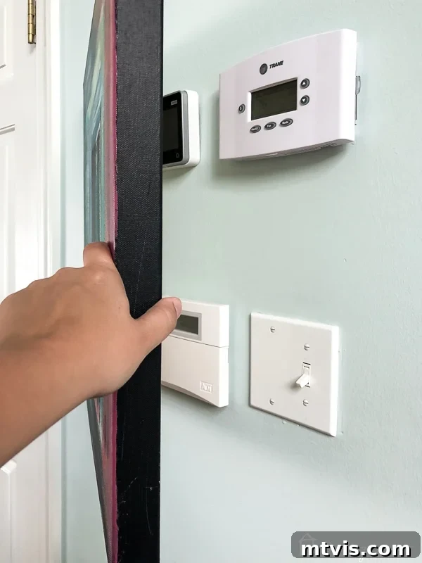 Effortless DIY Abstract Art Canvas 10 DIY abstract art concealing thermostat and alarm panel