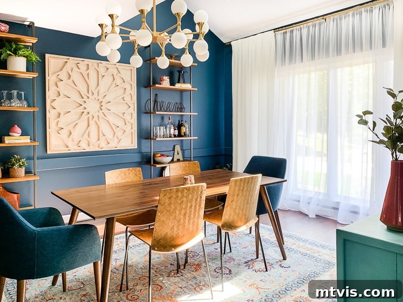 8 Unconscious Interior Design Mistakes You're Making (and Simple Solutions) 11 navy blue dining room with Article furniture and well-hung curtains