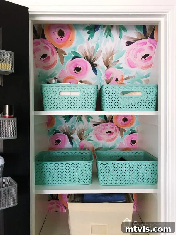 5 Steps to Perfectly Install Removable Wallpaper 8 The finished look of removable wallpaper installed in a closet, showing a vibrant floral pattern and organized shelves.