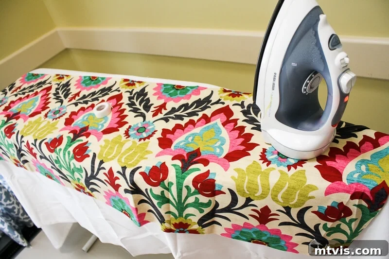 Effortless No-Sew Curtain Hack 4 Cutting and ironing accent fabric for no-sew curtains.