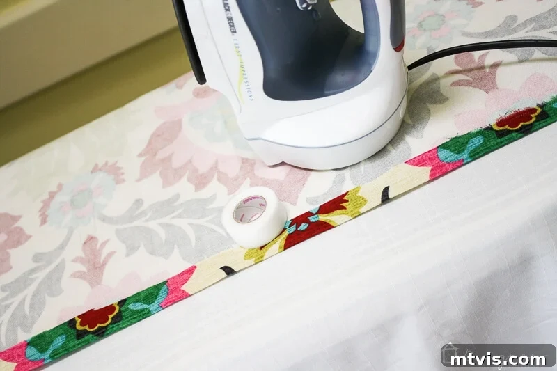 Effortless No-Sew Curtain Hack 5 Folding and ironing the top edge of accent fabric.