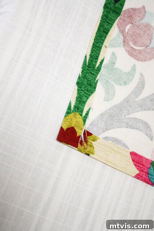 Effortless No-Sew Curtain Hack 7 Finished corner of accent fabric with secured no-sew hems.