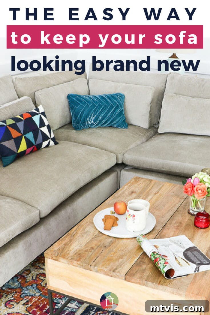 A light grey L-shaped sectional sofa adorned with bright, colorful pillows sits comfortably in front of a rustic light wood pallet coffee table. The prominent text overlaid on the image reads, "The easy way to keep your sofa looking brand new," highlighting the article\