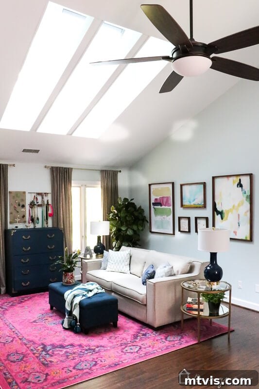Our Blush and Indigo Sanctuary Unveiling 5 Cozy navy and pink sitting area in a master bedroom with new, substantial curtain rods and elegant drapes