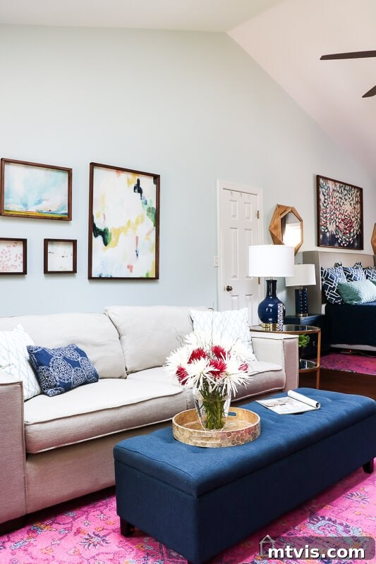 Our Blush and Indigo Sanctuary Unveiling 8 Another perspective of the stylish pink and navy master bedroom, showcasing the overall design and layout