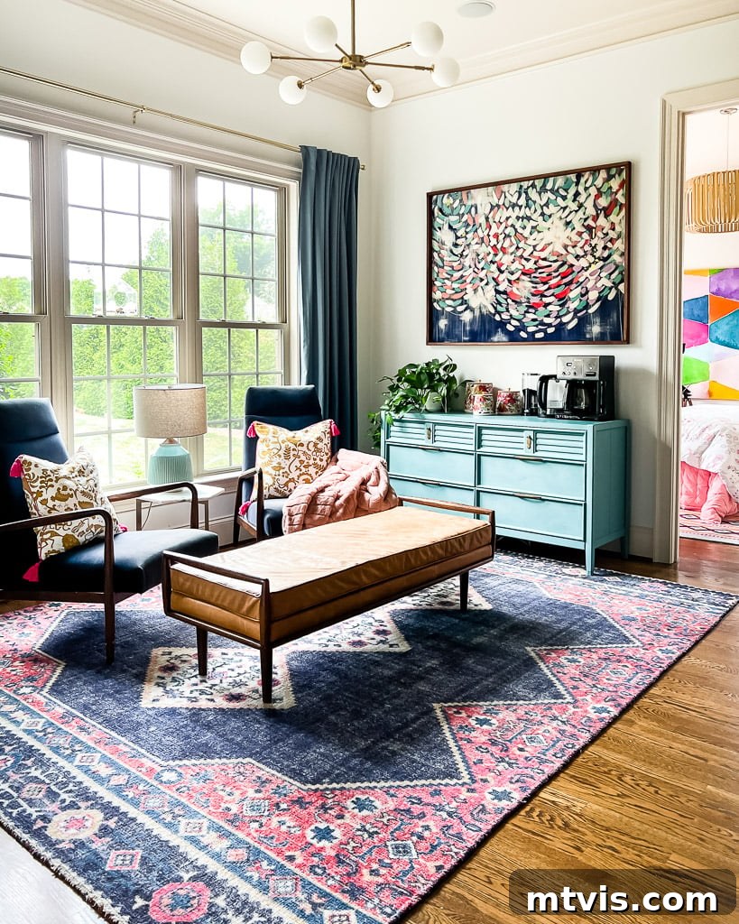 Beyond Beige: Your Starter Guide to Decorating with Color 12 Velvet navy blue accent chairs in a casual sitting area, with colorful vintage canisters on a blue dresser in the background.