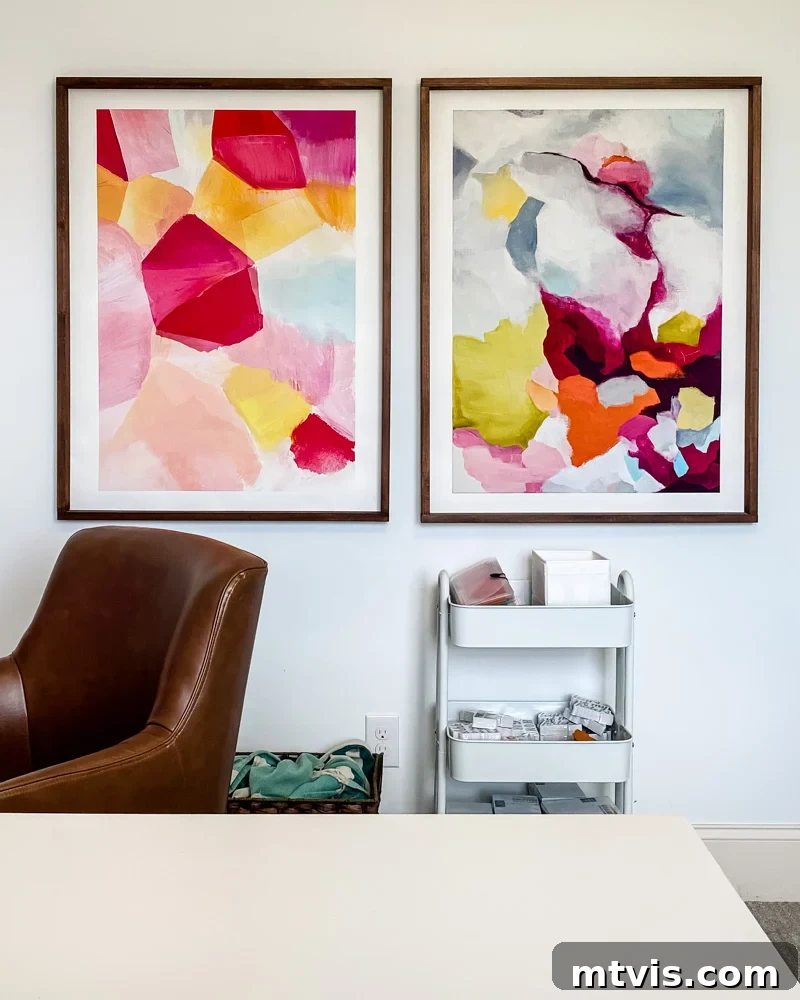 Beyond Beige: Your Starter Guide to Decorating with Color 4 Large abstract colorful art displayed in a bright, modern office space.