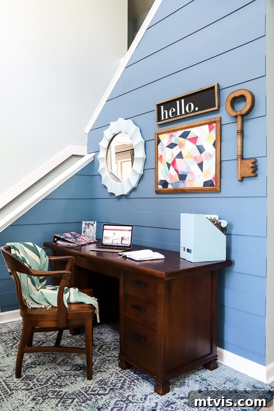 Close-up of the modern DIY plank wall texture and color, with a contemporary mirror.