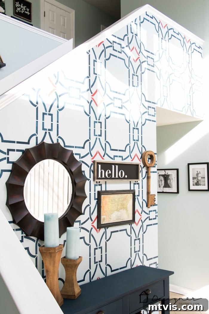 Another before image of the stenciled wall in the foyer, showing a detailed pattern.