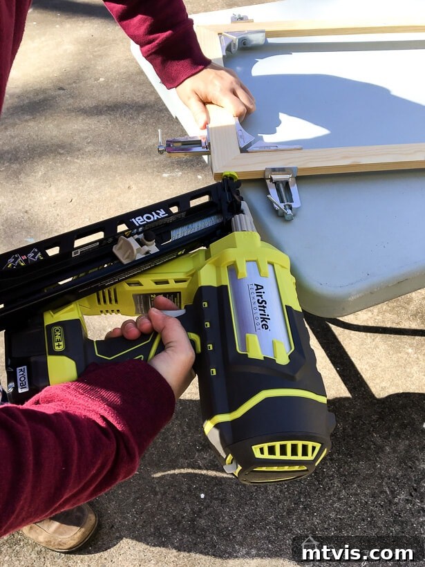Stylish DIY Vent Cover Made Simple 5 Assembling a wood frame using clamps and adhesive for a DIY project.