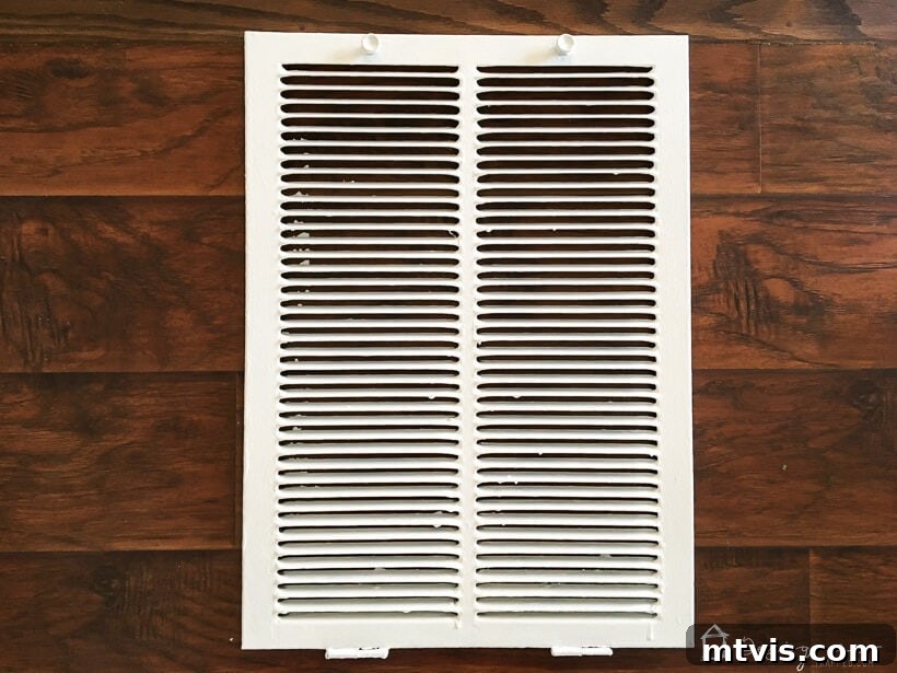 Stylish DIY Vent Cover Made Simple 8 Before and after comparison of a builder-grade air vent cover and a DIY decorative one.