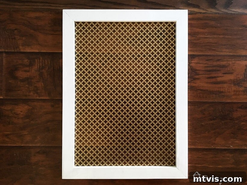 Stylish DIY Vent Cover Made Simple 9 Close-up of a new DIY decorative air vent cover with intricate metal pattern.