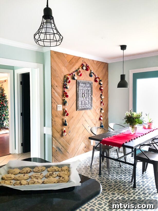 colorful Christmas decor in kitchen with Santa garland