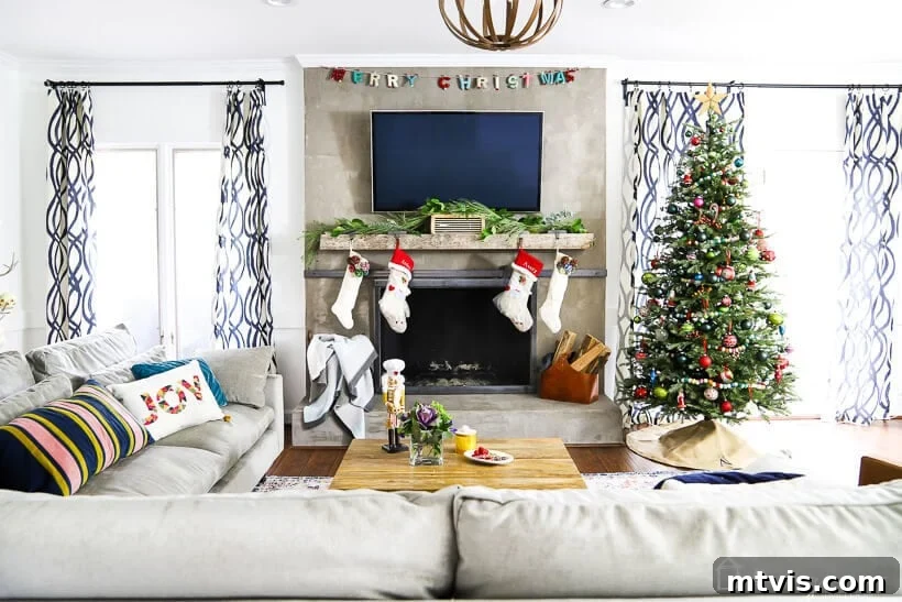 colorful Christmas decor in living room with garland and stockings