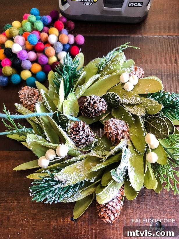 Mini Wreaths: Tiny Touches, Big Christmas Joy 3 Attaching felt balls to a mini wreath with a hot glue gun