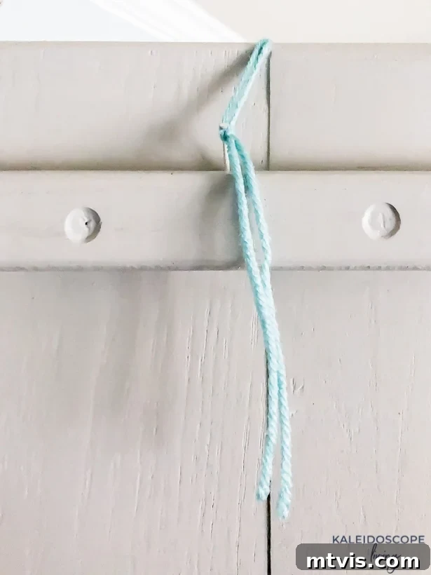 Mini Wreaths: Tiny Touches, Big Christmas Joy 5 Installing small nails on the back of a cabinet door for hanging wreaths