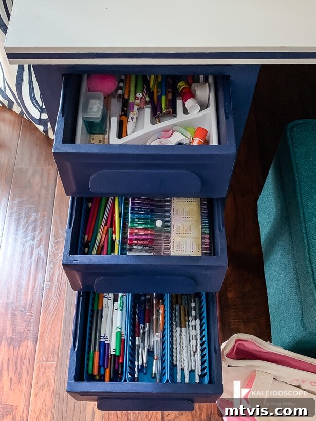 Chalk Paint Secrets: Your Complete Guide to Furniture Makeovers 14 Detail shot of the desk painted with Behr chalk paint in timeless blue, highlighting the organized drawers. The long-lasting finish makes it practical for kids' use.
