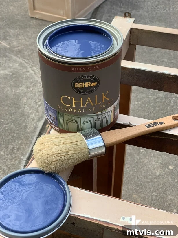 Chalk Paint Secrets: Your Complete Guide to Furniture Makeovers 6 Applying Behr Chalk Decorative Paint in Timeless Blue to furniture, demonstrating the smooth application of chalk paint for a beautiful finish. Second coat going on for full coverage.