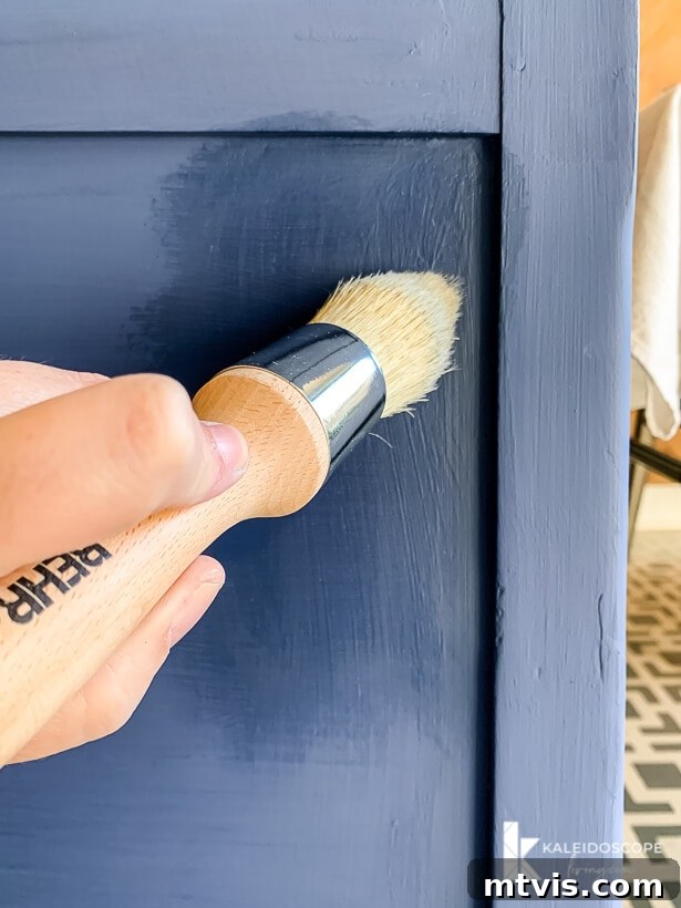 Chalk Paint Secrets: Your Complete Guide to Furniture Makeovers 8 Applying Behr Decorative Wax Finish to painted furniture, demonstrating the final step for a durable and beautiful long-lasting finish. Buffing the wax for a smooth sheen. Behr Chalk Decorative Paint project.