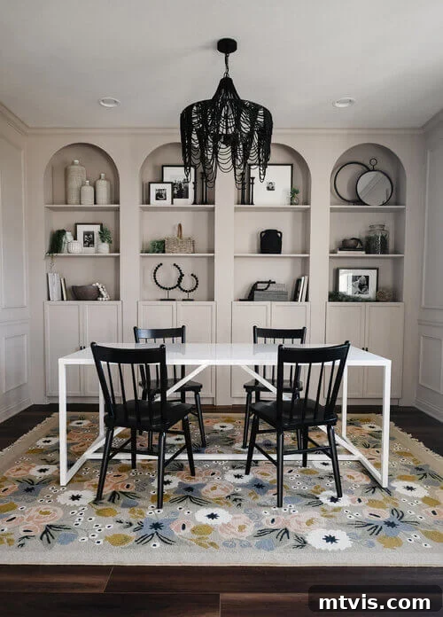 IKEA Smart Hacks: Custom Built-Ins and Bookshelf Upgrades 8 Billy bookcase built-ins with added arches are flush to the dining room wall, with a black chandelier, white table and black chairs.