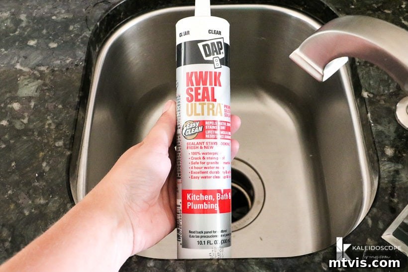 Caulking Made Easy A Beginner's Guide 4 DAP Kwik Seal Utra held over a small stainless-steel sink.