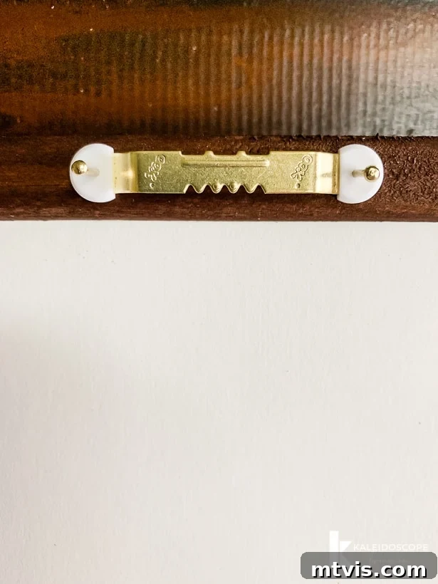 DIY Oversized Frames Stunning Decor Under $20 15 Attaching sawtooth hangers for hanging DIY art frames.