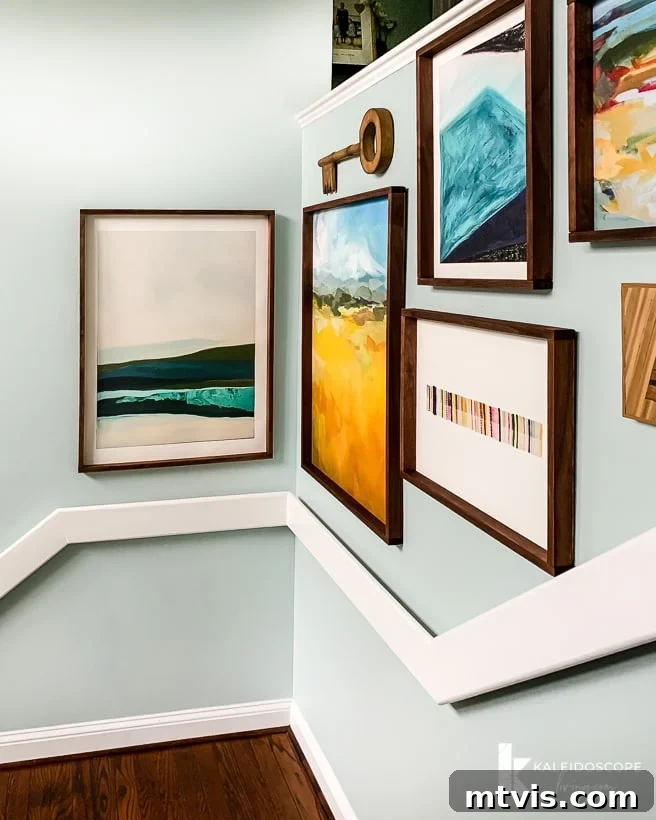 DIY Oversized Frames Stunning Decor Under $20 17 A gallery of large DIY art frames decorating a modern stairwell.