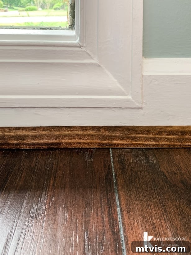 freshly repaired baseboard molding with quarter round