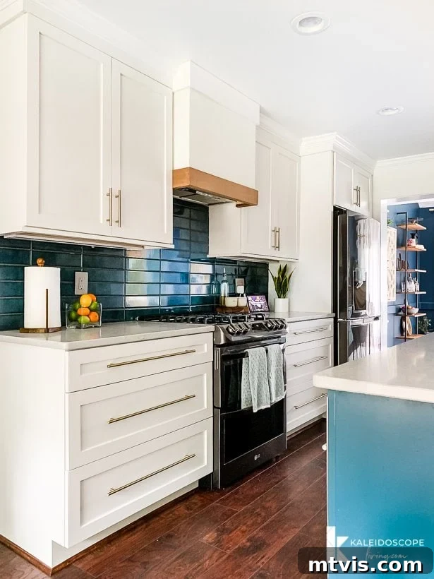 white and teal kitchen with modern stacked tile backsplash, showcasing contemporary details