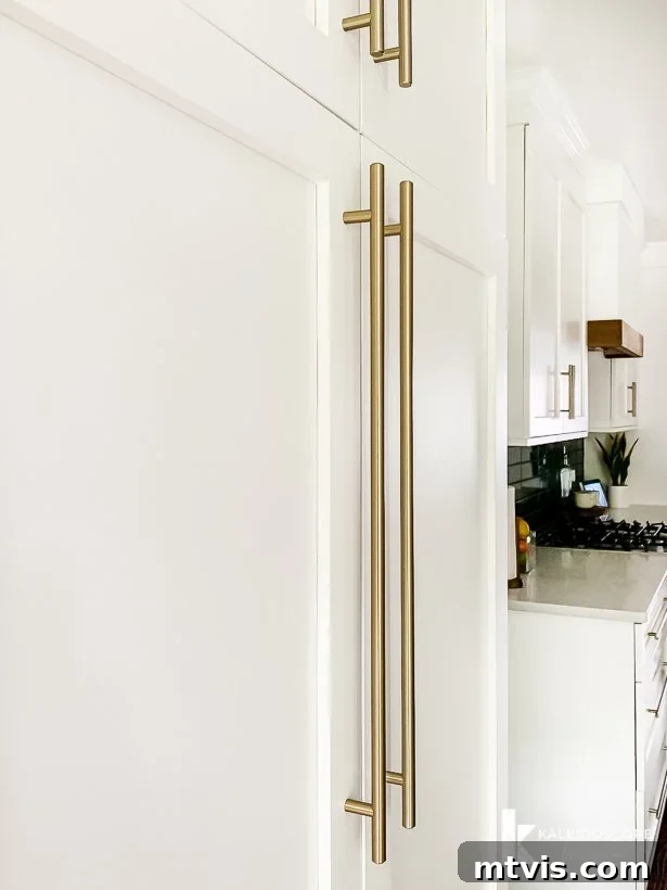 Amerock golden champagne bar pulls on pantry cabinets, showcasing elegant hardware