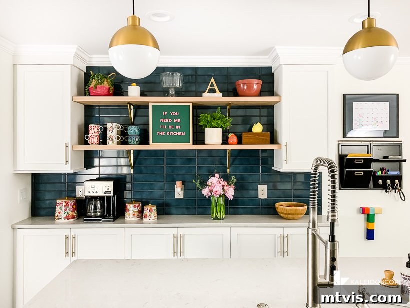 white and teal kitchen remodel after photo, showing the overall bright and airy atmosphere
