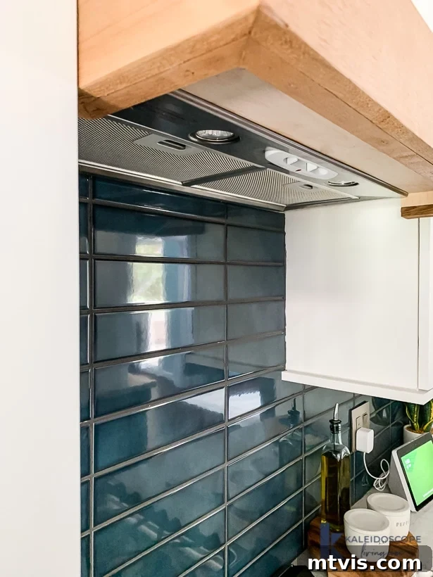 Wood and White Concrete: A DIY Range Hood Transformation 15 View of the DIY range hood from directly underneath, showcasing the clean lines and wood trim