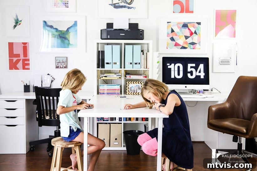 My New Home Office and Crafting Sanctuary Unveiled 10 Bright home office with a functional double desk setup and gallery wall