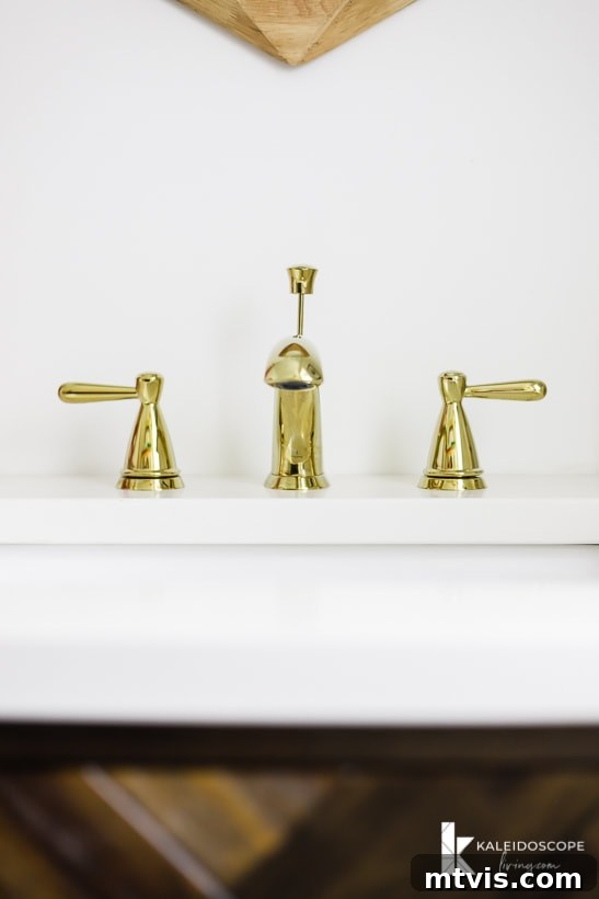 Handmade Hues: Our Vibrant Bathroom Makeover 14 Close-up of the Delta Peerless faucet in polished brass, showcasing its elegant design.