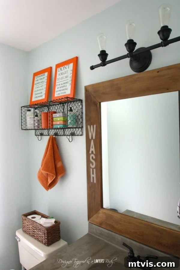 Handmade Hues: Our Vibrant Bathroom Makeover 3 Powder room with inexpensive updates including a DIY concrete overlay vanity and a wood and concrete mirror frame.