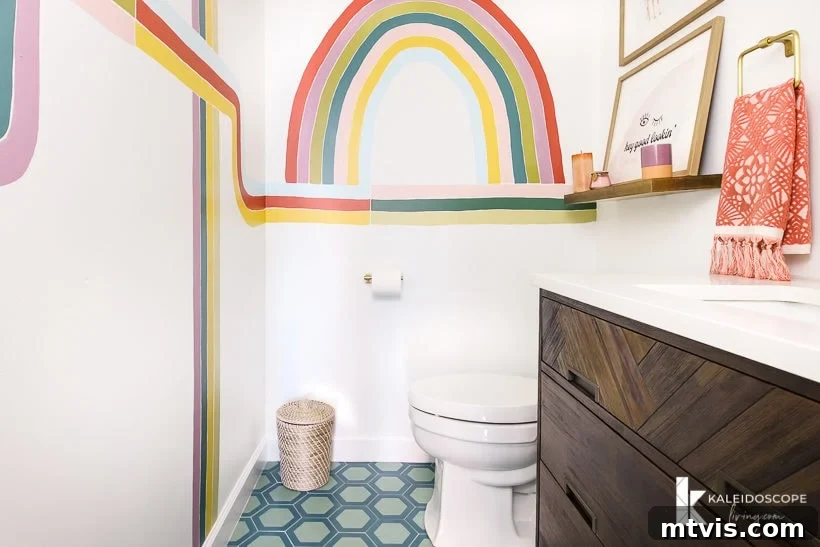 Handmade Hues: Our Vibrant Bathroom Makeover 8 Chic powder room featuring colorful wall mural, cement floor tile, and modern fixtures.