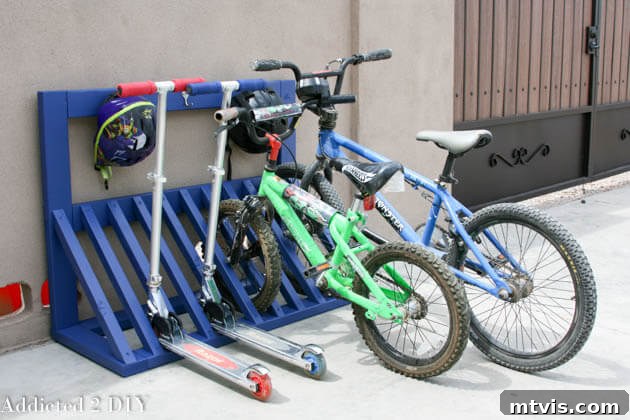 Simple DIY bike and scooter rack with helmet hooks, designed for easy use by children.