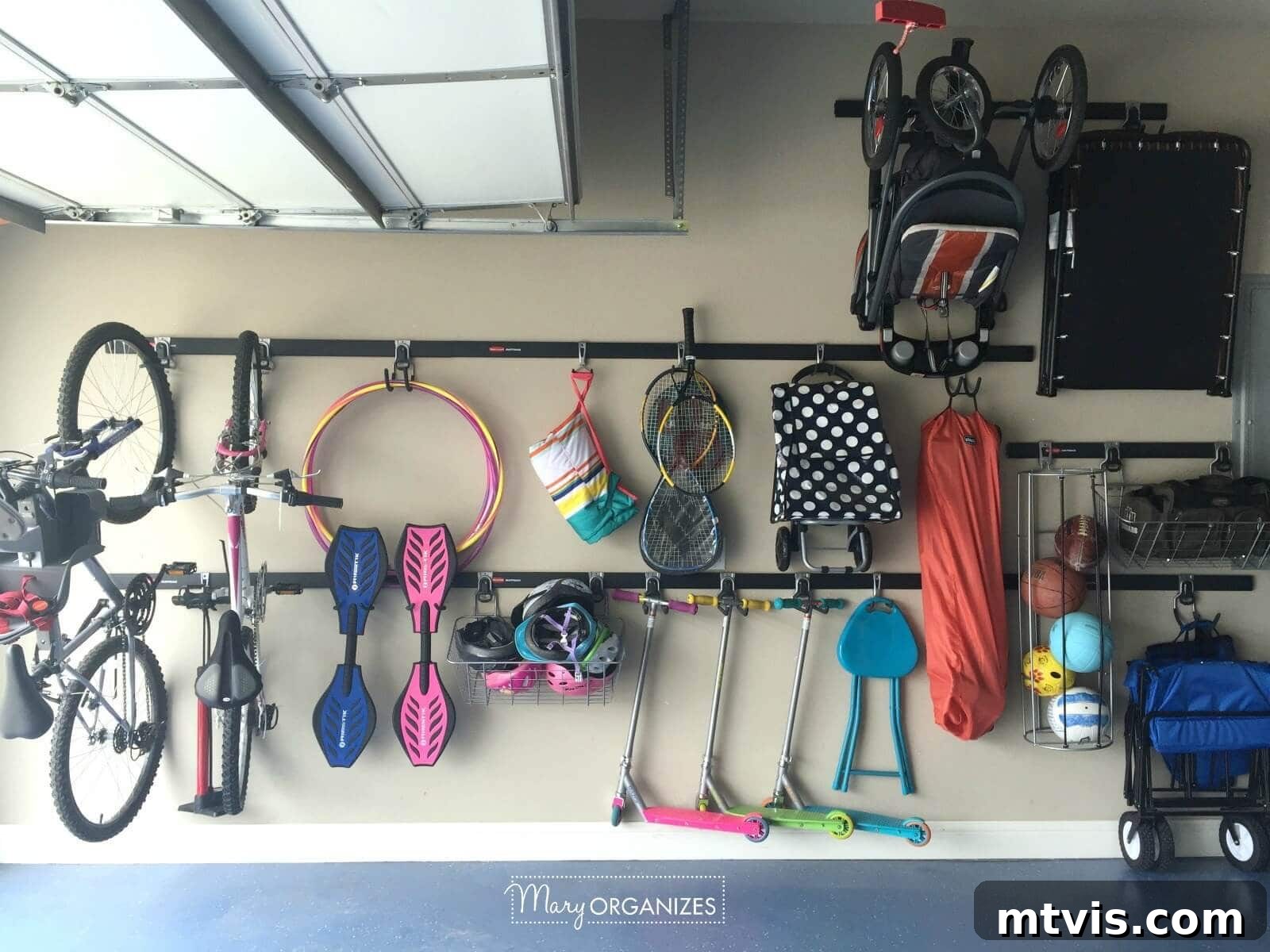 Garage rail storage system for hanging scooters, bikes, and various sports equipment, maximizing wall space.