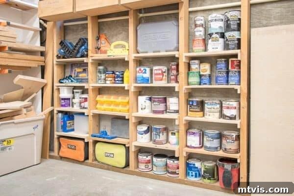 Creative DIY garage storage shelves built between wall studs, ideal for slender items.