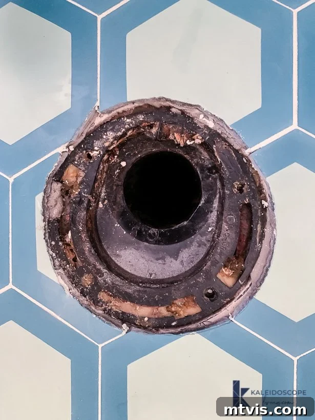 cracked toilet flange requiring repair before new toilet installation