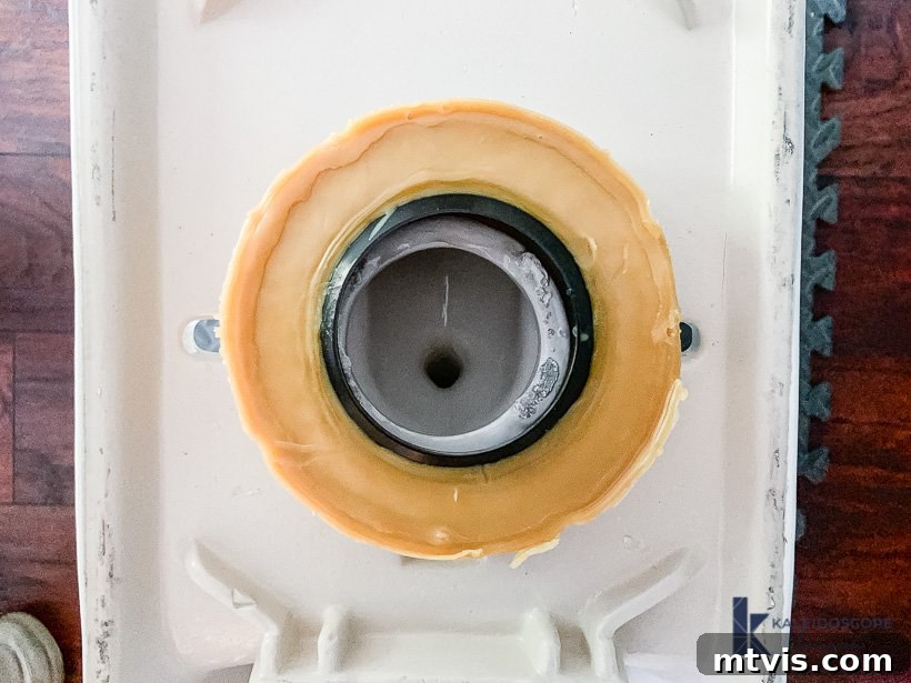 new wax ring installed on the bottom of a toilet bowl