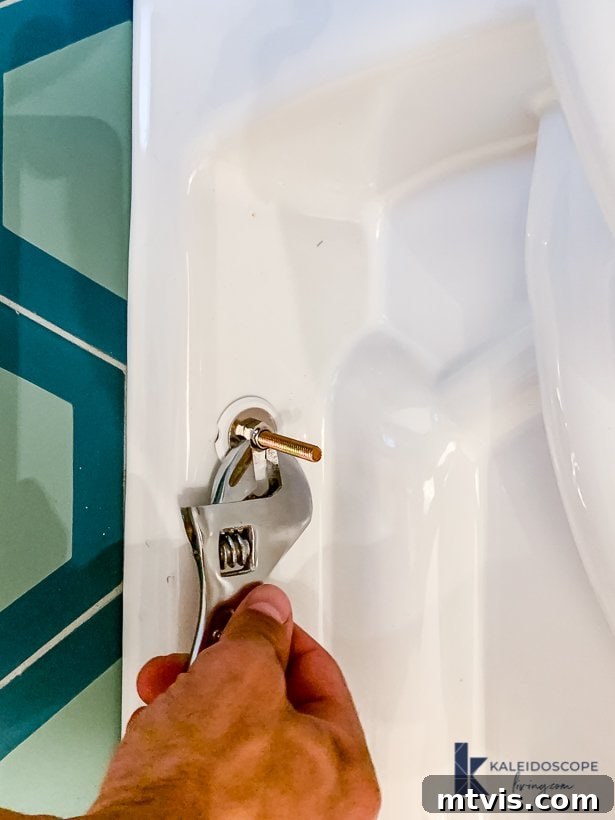 tightening nuts on toilet bowl base bolts