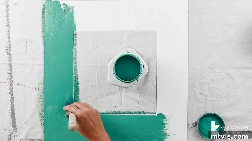 Bright DIY Memory Wall 5 Applying paint to picture photo mats for a unique gallery wall