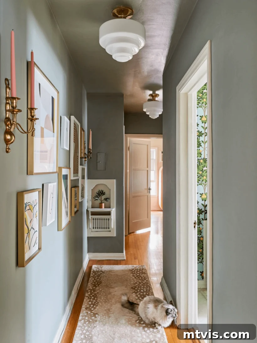 23 Genius and Stylish Hallway Decor Ideas 7 long hallway with gallery wall and matching light fixtures