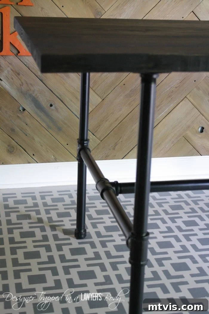 Crafting Your Own Pipe Table 10 Aesthetic shot of the DIY Industrial Pipe Table styled with dining chairs and kitchen decor