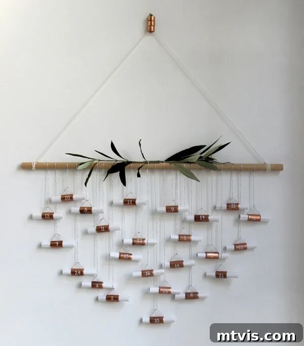 Magical Advent Calendar and Countdown Ideas for Christmas 4 A stylish hanging copper pipe Advent calendar, showcasing minimalist design, perfect for displaying daily messages or small thoughtful items.