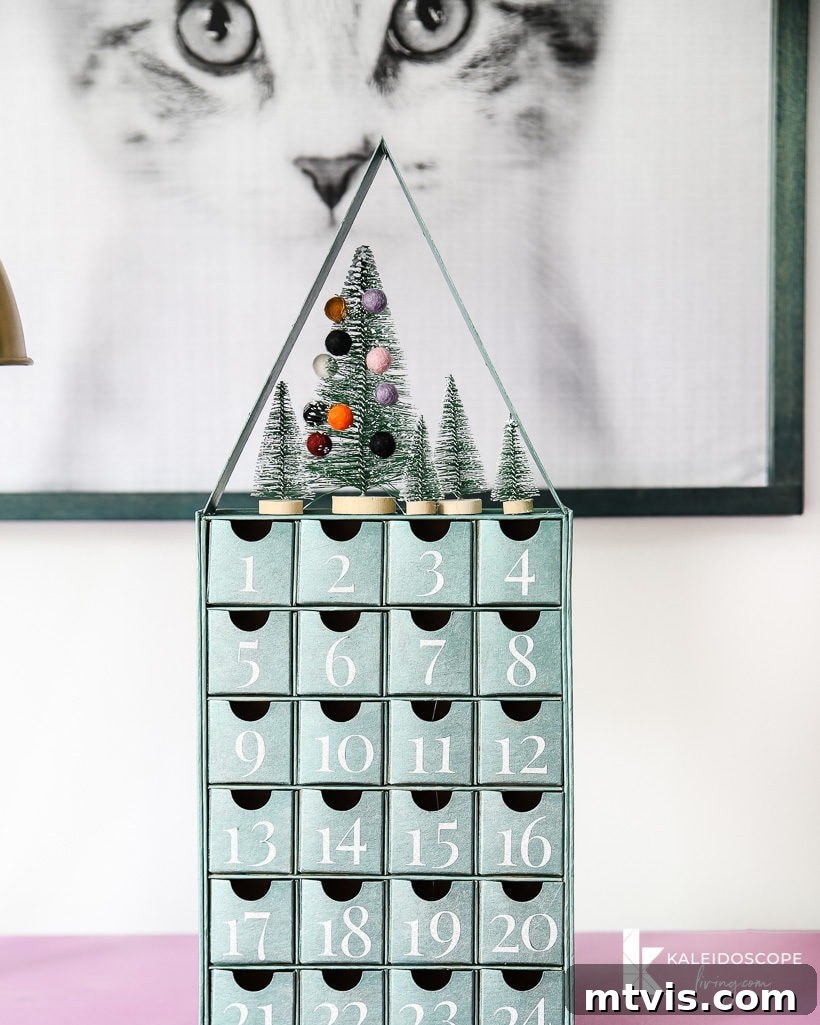 Personalized Advent Calendar Project with Cricut Explore Air 2 11 Avery's elegant personalized DIY Advent calendar, featuring silver glitter vinyl numbers and a metallic blue-green base, complementing her chic room decor.