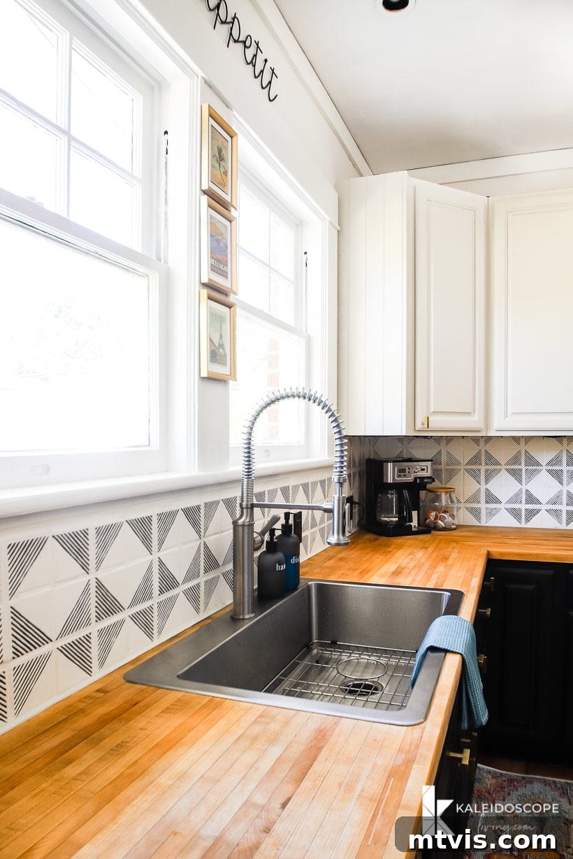 Backsplash Makeover Paint Your Tiles Like a Pro in 5 Steps 14 corner view of a kitchen with painted backsplash and blue cabinets