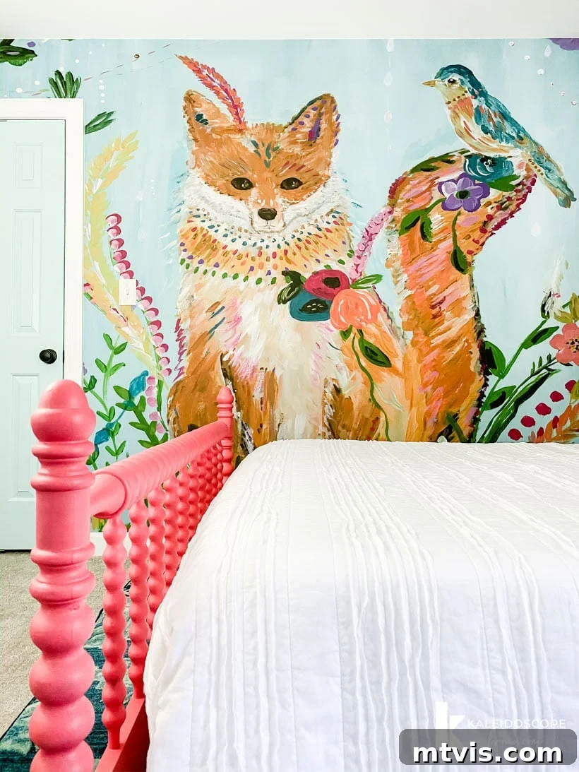 Expansive view of Attley's colorful girl's bedroom, showcasing the artistic wall mural, thoughtful furniture placement, and overall harmonious design, perfect for inspiring kids' room decor.