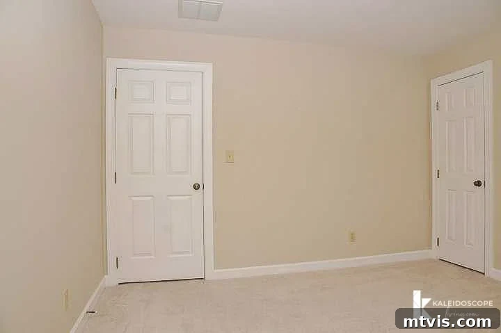 Before image of an empty, plain bedroom, emphasizing the bland, beige walls, perfect for illustrating a girl's room makeover transformation.